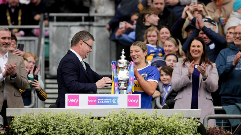 President of the camogie association Brian Molloy presenting captain Karen Kennedy with the cup